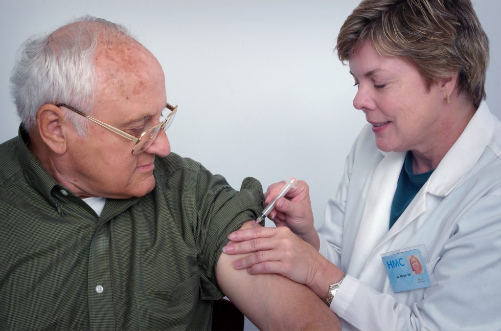 senior man getting a vaccine