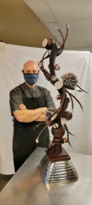 man with his chocolate sculpture
