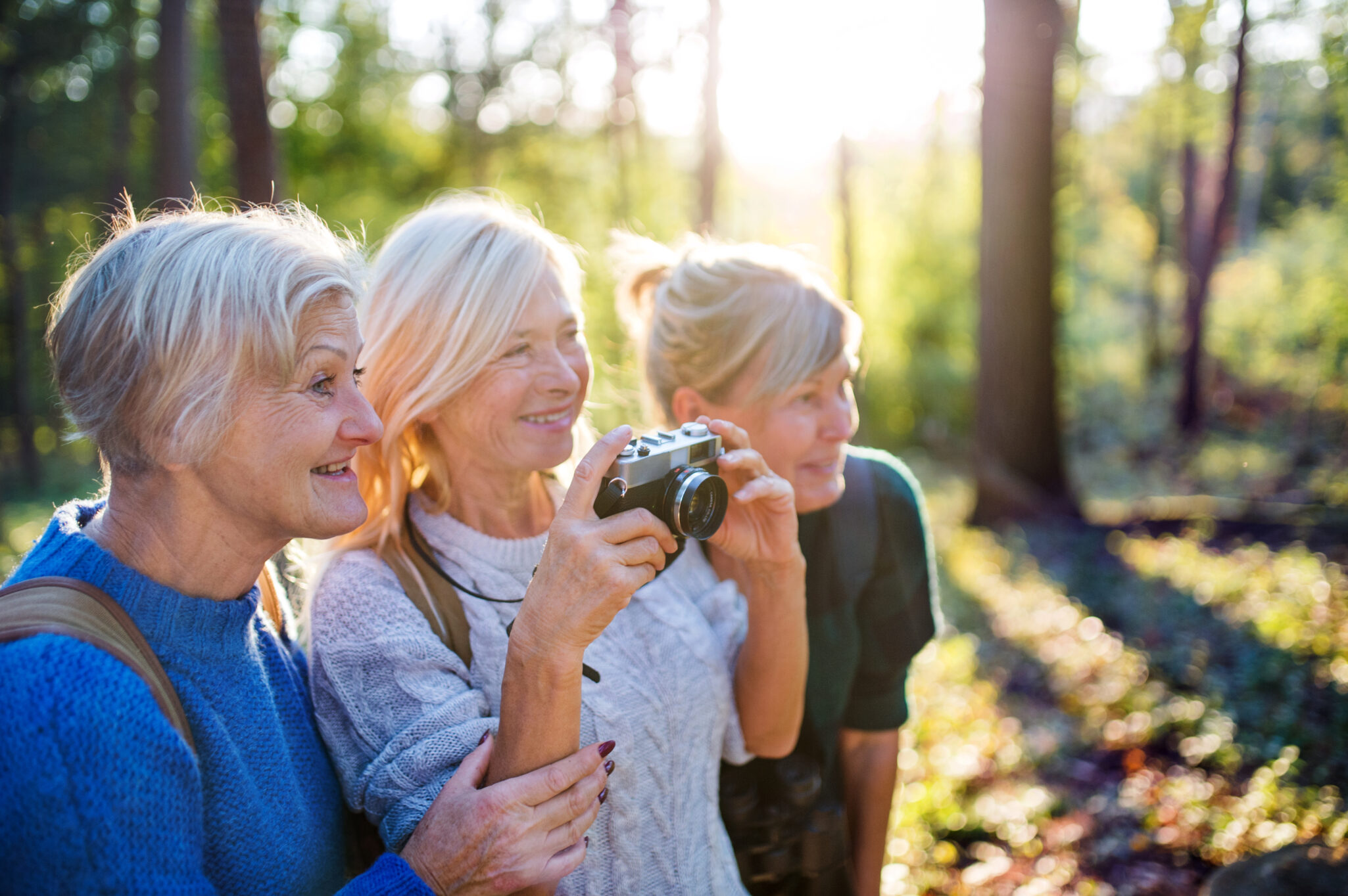 friends enjoying one of the best outdoor activities for seniors, photography in nature