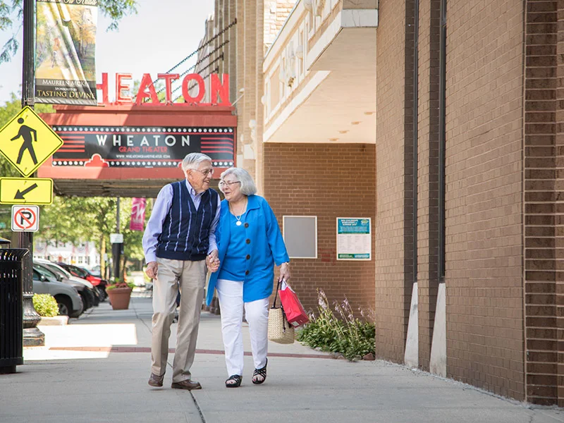 senior couple on a walk around Wheaton, IL