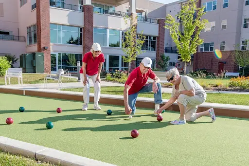 wyndemere residents following summer safety tips for seniors y wearing hats while playing bocce ball in the sun