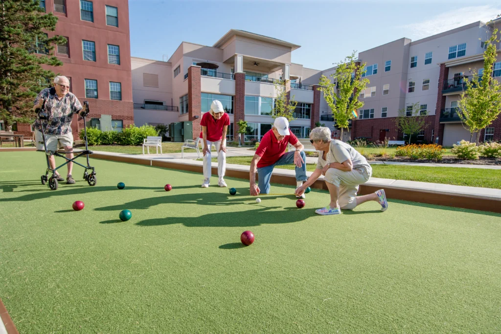 Senior residents at Wyndemere in Wheaton, IL playing bocce ball.