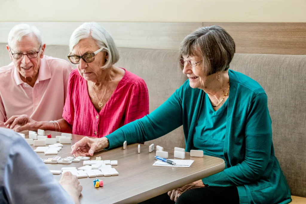 residents at Wyndemere playing Dominoes