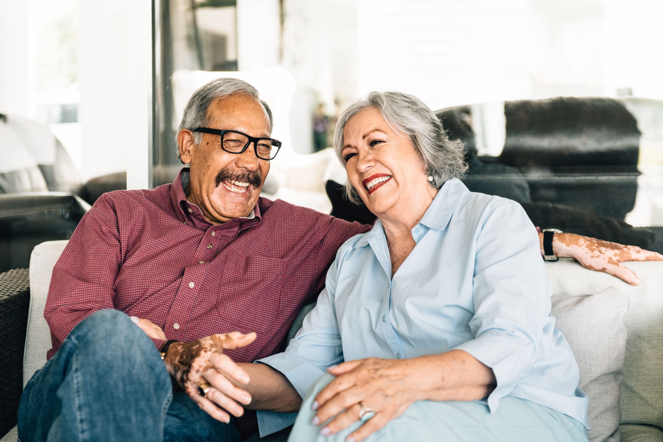Senior couple sitting and laughing together