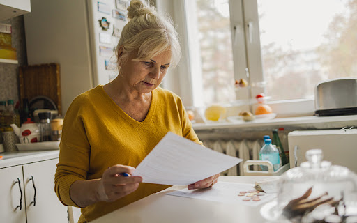 woman looking over her living will at home